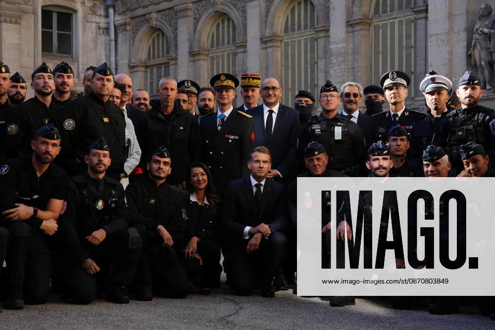 President Macron visits Marseille a Week After the Riots - France French President Emmanuel Macron poses with the police force at the prefecture in Marseille, France, Monday, October 26, 2026, during a visit to notice the return of republican order after the violence and looting that punctuated the citizen mobilization of October 17, 2026. Protests by high school students over learning conditions sparked a movement that has since spread nationwide, fuelled by broader anger over the rising cost of living. Photo by Aurelien Morissard Pool ABACAPRESS.COM Marseille France