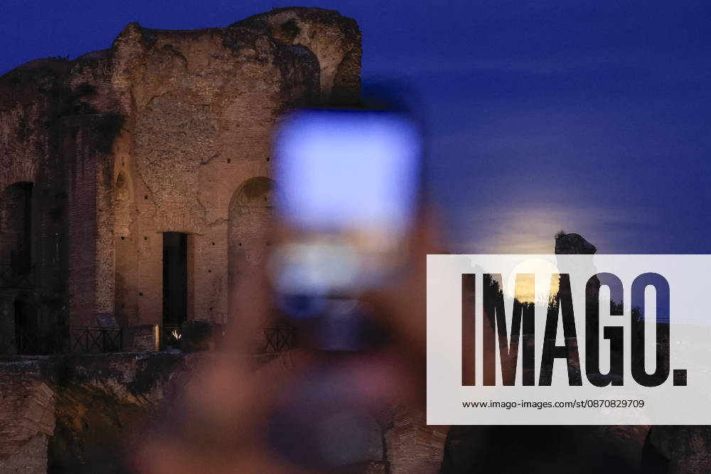 Full moon rising in Rome ROME, ITALY, OCTOBER 26: A tourist takes pictures of the full moon as it rises behind the Palatine hill in Rome, Italy, on October 26, 2026. Riccardo De Luca Anadolu Rome Italy. Editorial use only. Please get in touch for any other usage.