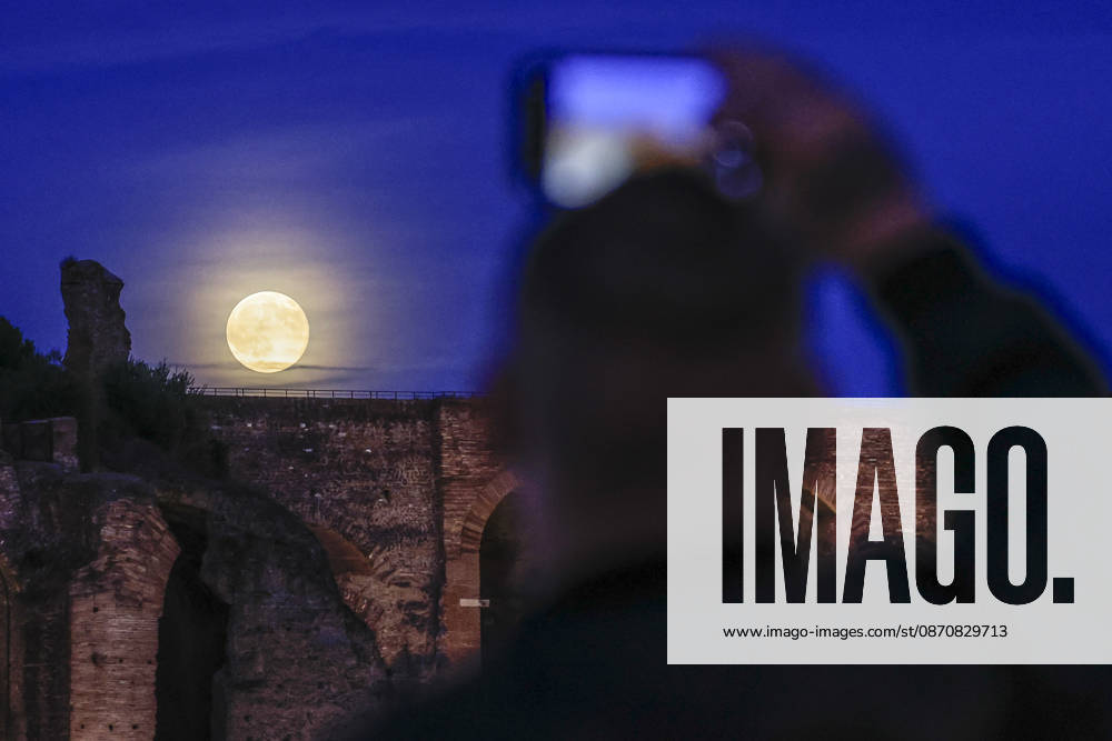 Full moon rising in Rome ROME, ITALY, OCTOBER 26: A tourist takes pictures of the full moon as it rises behind the Palatine hill in Rome, Italy, on October 26, 2026. Riccardo De Luca Anadolu Rome Italy. Editorial use only. Please get in touch for any other usage.