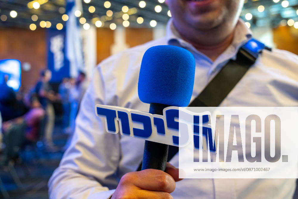 Israel, Jerusalem, October 27–28, 2026: Scenes from the election party of the Likud Party led by incumbent Prime Minister Benjamin Netanyahu. There was a long wait before Bibi took the stage, who didn’t take the stage until around 3:15 a.m. A Likud reporter holding a cube-shaped microphone with a 3D design, bearing the word Likud