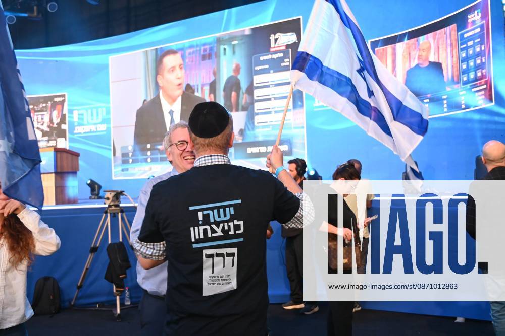 Supporters of G. Eisenkot s Yashar party gather at the party s campaign headquarters in Tel Aviv as initial exit polls are released following Israel s parliamentary elections. The projections give the opposition bloc an advantage over Prime Minister B. Netanyahu s bloc, with neither securing a parliamentary majority. Tel Aviv Israel - ZUMAq101 20261027_zna_q101_222