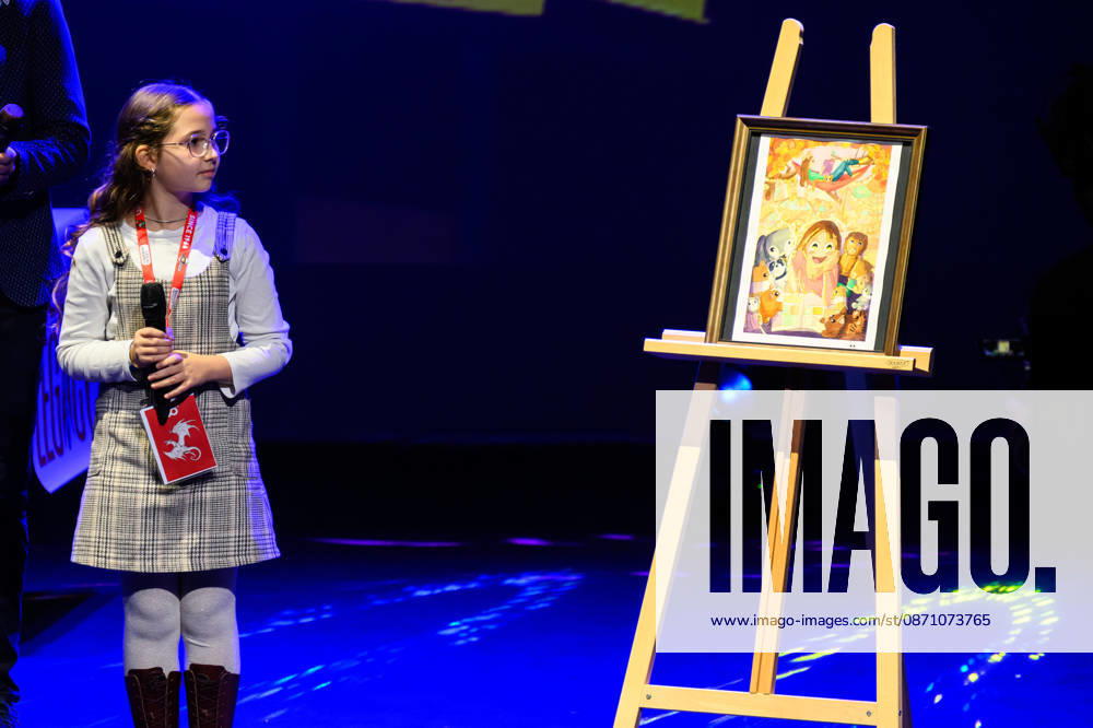 The variant cover of the poster created by the young talent Louise Sto phant (winner of the Petit Fauve in Angouloªme) is unveiled on the theatre stage during the inauguration of the 60th edition of Lucca Comics & Games, Lucca, 28 10 2026 Lucca Italy - ZUMAa289 20261028_zia_a289_160