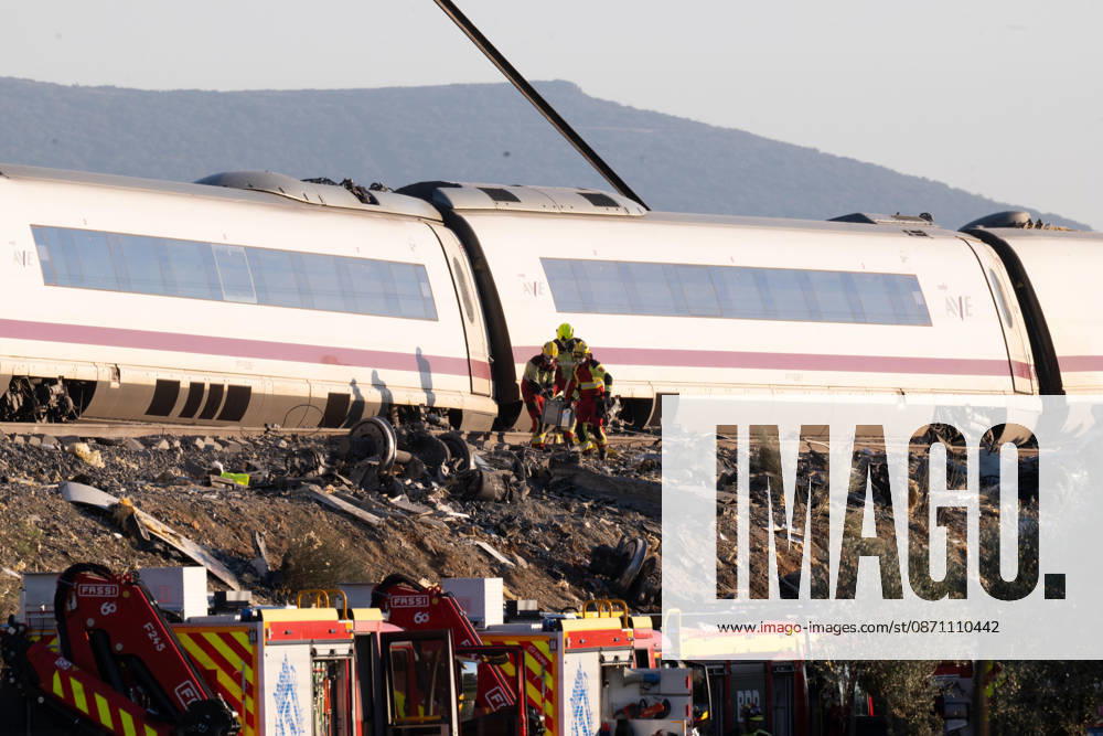 October 28, 2026, Urda, Toledo, Spain: October 28, 2026, Urda, Toledo, Spain: At least 68 people have died and dozens more were injured after two high-speed passenger trains collided near Urda station in the province of Toledo on Wednesday morning, regional authorities confirmed. The catastrophe occurred at approximately 08:53 AM when a state-owned Renfe AVE train struck the rear of a stationary train operated by private carrier Iryo. More than 500 passengers were on board both convoys, which were traveling along the Madrid-Andalusia high-speed corridor. Spanish Transport Minister ü scar Puente stated that the collision followed a safety system failure, after which an inexplicable order was issued - ZUMAd308 20261028_zsp_d308_096