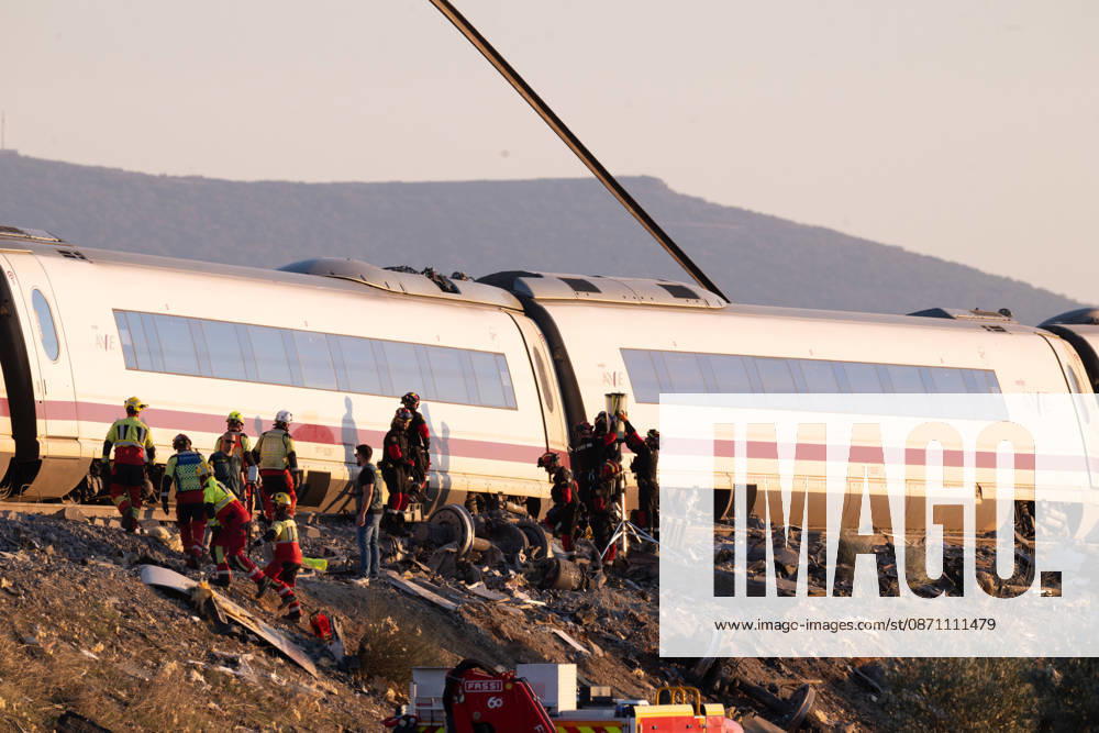 October 28, 2026, Urda, Toledo, Spain: October 28, 2026, Urda, Toledo, Spain: At least 68 people have died and dozens more were injured after two high-speed passenger trains collided near Urda station in the province of Toledo on Wednesday morning, regional authorities confirmed. The catastrophe occurred at approximately 08:53 AM when a state-owned Renfe AVE train struck the rear of a stationary train operated by private carrier Iryo. More than 500 passengers were on board both convoys, which were traveling along the Madrid-Andalusia high-speed corridor. Spanish Transport Minister ü scar Puente stated that the collision followed a safety system failure, after which an inexplicable order was issued - ZUMAd308 20261028_zsp_d308_118