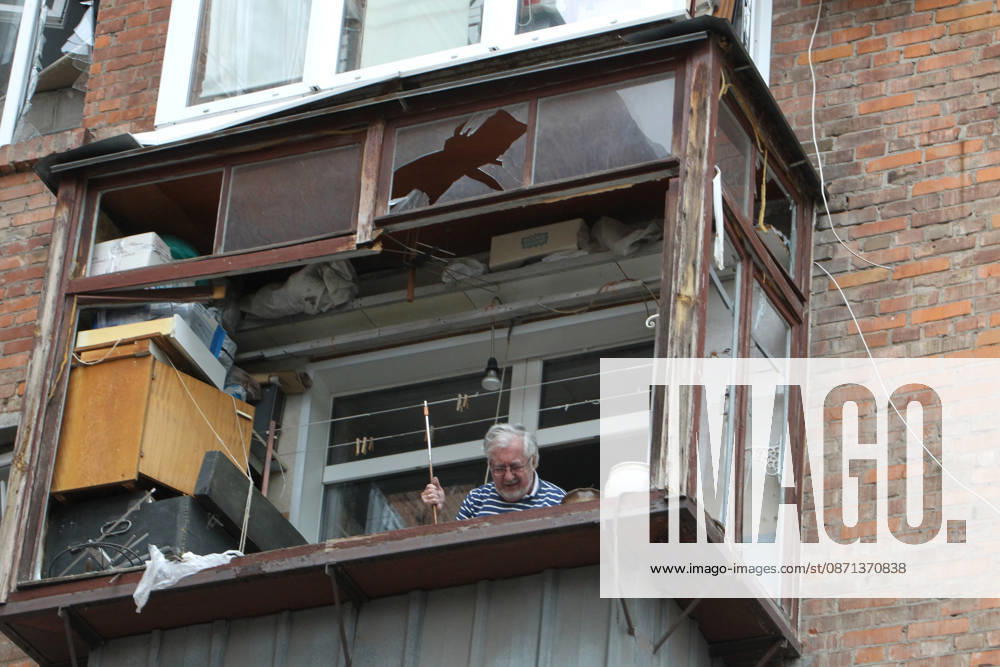 An elderly man stands on the balcony in an apartment block on Oleksandra Polia Avenue damaged by a Russian drone strike in Dnipro, Ukraine, on October 30, 2026. The Russian attack damaged at least five residential high-rise buildings and a school. More than 300 windows were shattered in the strike. (Photo by Mykola Miakshykov Ukrinform) Russian attack damages residential buildings and school in Dnipro