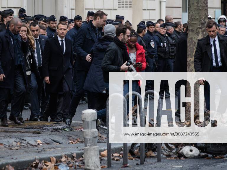 French President Emmanuel Macron (L), accompanied by Christophe Castaner, Minister of the Interior, went to rue Kleber to greet the troops of the police and fire brigades mobilized last night, during the Yellow Vests protest a day earlier next to the Champs Elysee in Paris, France, on December 2nd 2018.