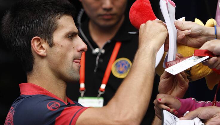 BEIJING, Oct. 9, 2010 - Novak Djokovic of Serbia signs autographs after the men s singles semifinal at the China Open tennis tournament in Beijing, capital of China, Oct. 9, 2010.