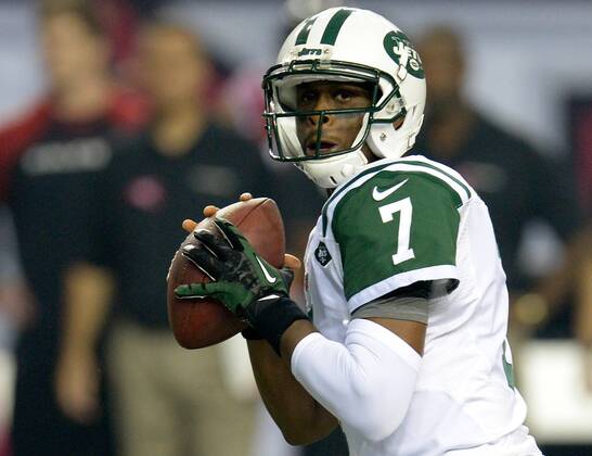 New York Jets quarterback Geno Smith looks downfield against the Atlanta Falcons during the first half at the Georgia Dome in Atlanta on October 7, 2013. Smith threw for two touchdowns in the first half.  AJP2013100712