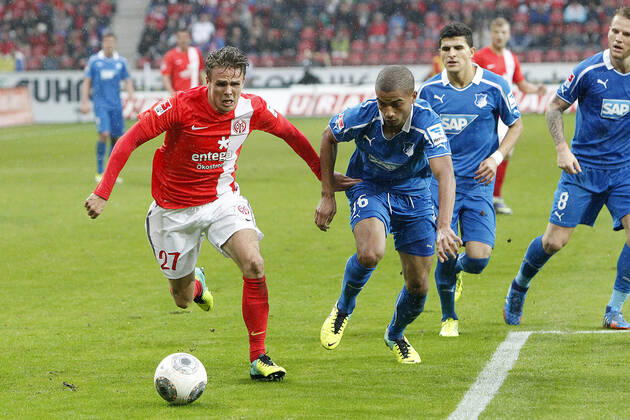 Mainz, Germany 05 October 2013 1 Bundesliga 13 14 8 Matchday 1 FSV Mainz 05 vs 1899 Hoffenheim v li Nicolai Müller Mainz in duel against Jeremy Toljan Hoffenheim , in background v li Nicolai Müller Mainz , Jeremy Toljan Hoffenheim , t.s., landscape 1 Bundesliga 13 14 8 Matchday 1 FSV Mainz 05 vs 1899 Hoffenheim jr