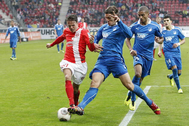 Mainz, Germany 05 October 2013 1 Bundesliga 13 14 8 Spieltag 1 FSV Mainz 05 vs 1899 Hoffenheim v le Nicolai Müller Mainz in a duel against Jannik Vestergaard Hoffenheim , in the background v le Jeremy Toljan Hoffenheim , Tarik Elyounoussi Hoffenheim , t.s., landscape 1 Bundesliga 13 14 8 Spieltag 1 FSV Mainz 05 vs 1899 Hoffenheim jr