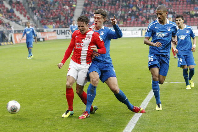 Mainz, Germany 05 October 2013 1 Bundesliga 13 14 8 Spieltag 1 FSV Mainz 05 vs 1899 Hoffenheim v le Nicolai Müller Mainz in a duel against Jannik Vestergaard Hoffenheim , in the background v le Jeremy Toljan Hoffenheim , Tarik Elyounoussi Hoffenheim , t.s., landscape 1 Bundesliga 13 14 8 Spieltag 1 FSV Mainz 05 vs 1899 Hoffenheim jr