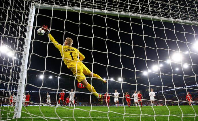Mandatory Credit: Photo by Kieran McManus BPI Shutterstock (9982413bv) Kasper Schmeichel of Denmark dives to save a free kick from Gareth Bale of Wales Wales v Denmark ,UEFA Nations League, League B, Group 4, Football, Cardiff City Stadium, Cardiff, UK - 16 Nov 2018 Wales v Denmark ,UEFA Nations League, League B, Group 4, Football, Cardiff City Stadium, Cardiff, UK - 16 Nov 2018  Copyright: xKieranxMcManus BPI Shutterstockx 9982413bv
