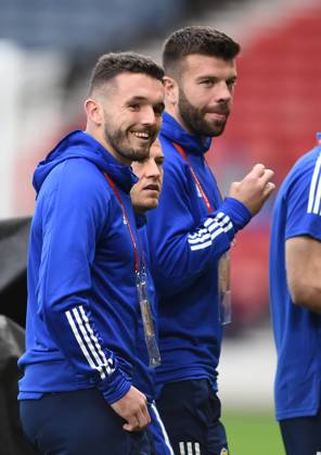 Glasgow, Scotland, 9th October 2021. John McGinn, Ryan Fraser and Grant Hanley, of Scotland before the FIFA World Cup, WM, Weltmeisterschaft, Fussball qualifiers match at Hampden Park, Glasgow. Picture credit should read: Neil Hanna Sportimage EDITORIAL USE ONLY. No use with unauthorised audio, video, data, fixture lists, club league logos or live services. Online in-match use limited to 120 images, no video emulation. No use in betting, games or single club league player publications. SPI-1226-0010