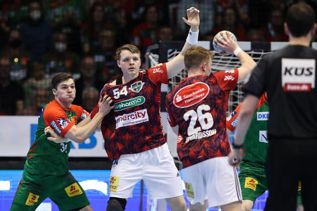 Justus Fischer TSV Hannover Burgdorf,54 and Jonathan Edvardsson TSV Hannover Burgdorf,26 against Kay Smits SC Magdeburg,31 Handball Bundesliga season 2021 2022 SC Magdeburg vs TSV Hannover Burgdorf at GETEC Arena in Magdeburg Action,man,men,handball,Germany,31 03 2022