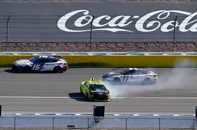 LAS VEGAS, NV - OCTOBER 16: Ryan Blaney ( 12 Team Penske Menards Knauf Ford) spins as JJ Yeley ( 15 Rick Ware Racing ConectUS Kyocera Ford) and Denny Hamlin ( 11 Joe Gibbs Racing FedEx Office Toyota) drive past during the NASCAR, Motorsport, USA Cup Series Playoff South Point 400 Sunday October 16, 2022 at Las Vegas Motor Speedway in Las Vegas, Nevada. (Photo by Will Lester Icon Sportswire) AUTO: OCT 16 NASCAR Cup Series Playoff South Point 400 Icon2210163641