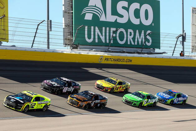 LAS VEGAS, NV - OCTOBER 16: Ryan Blaney ( 12 Team Penske Menards Knauf Ford) and several other cars drive through turn one during the NASCAR, Motorsport, USA Cup Series Playoff South Point 400, on October 16, 2022, at Las Vegas Motor Speedway in Las Vegas, NV.(Photo by Christopher Trim Icon Sportswire) AUTO: OCT 16 NASCAR Cup Series Playoff South Point 400 Icon221016042400