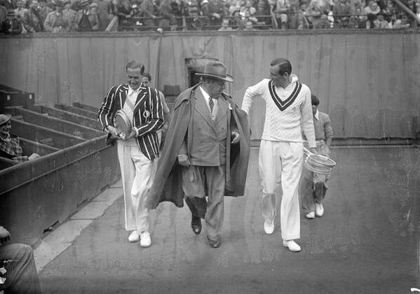Fred Perry and Gottfried Von Cramm , with the umpire , M Redelsperger , enter the center court at Roland Garros for the finals . 2 June 1936 France  Copyright: xTopFotox EU046256