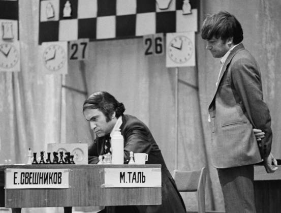 December, 1976. Moscow, USSR. Soviet Chess Grandmaster Mikhail Tal and chess player Alexander Zakharov (L-R) take part in the 1976 USSR Chess Championship in the Central House of Culture of Railway Workers. The exact date of the photograph is unknown. Vladimir Savostyanov TASS  18921720
