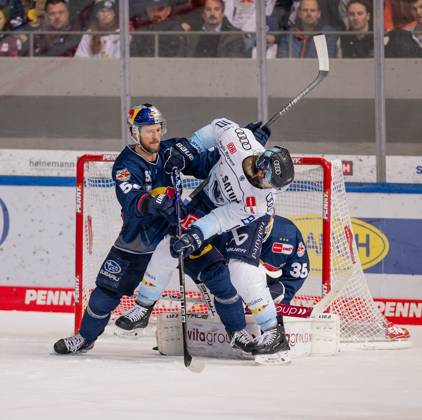 Patrick Hager EHC Red Bull Muenchen, 52 defends in front of Mathias Niederberger goalie, EHC Red Bull Muenchen, 35 against Mirko Hoefflin ERC Ingolstadt Panther, 10 EHC Red Bull Muenchen vs ERC Ingolstadt, ice hockey, DEL, playoffs, final game 3, season 2022 2023, 18 04 2023 EHC Red Bull Muenchen vs ERC Ingolstadt, ice hockey, DEL, playoffs, final game 3, season 2022 2023, 18 04 2023 Muenchen Copyright: xEibner-Pressefoto HeikexFeinerx EP_HFR