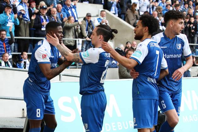 Goal celebration scorer Moritz Broni Kwarteng 1 FC Magdeburg,8 hits to the 1 0 with v l Baris Atik 1 FC Magdeburg,23 ,Herbert Bockhorn 1 FC Magdeburg,7 ,Daniel Elfadli 1 FC Magdeburg,6 2 Football Bundesliga season 2022 2023 1 FC Magdeburg vs Hamburger SV in the MDCC Arena in Magdeburg action,soccer,man,men,Germany,29 04 2023