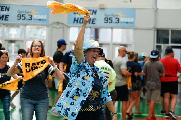 October 3, 2023, St. Petersburg, Florida, USA: Jean Priest, 64, of Sarasota, twirls a rally towel and cheers ahead of a Rays game against the the Texas Rangers at Tropicana Field in St. Petersburg on Tuesday, Oct. 3, 2023. St. Petersburg USA - ZUMAs70_ 20231003_zan_s70_028 Copyright: xJeffereexWoox