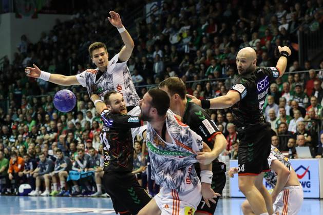 Renars Uscins TSV Hannover Burgdorf,10 and Ilija Brozovic TSV Hannover Burgdorf,44 against Christian O Sullivan SC Magdeburg,24 and Oscar Bergendahl SC Magdeburg,54 Handball Bundesliga Season 2023 2024 SC Magdeburg vs TSV Hannover Burgdorf at GETEC Arena in Magdeburg Action,Handball,Germany,15 10 2023