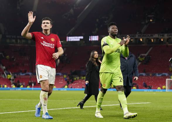 Manchester, England, 24th October 2023. Harry Maguire of Manchester United, ManU and Andrà Onana of Manchester United take the acclaim during the UEFA Champions League match at Old Trafford, Manchester. Picture credit should read: Andrew Yates Sportimage EDITORIAL USE ONLY. No use with unauthorised audio, video, data, fixture lists, club league logos or live services. Online in-match use limited to 120 images, no video emulation. No use in betting, games or single club league player publications. SPI-2672-0097