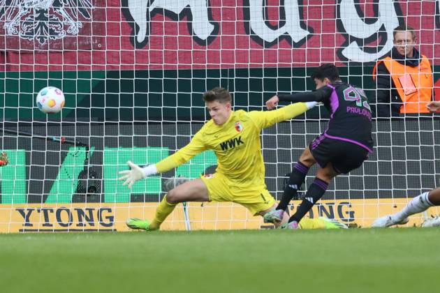 Aleksandar Pavlovic FC Bayern Munich scores to 0 1 against Finn Dahmen Goalkeeper FC Augsburg 1 FC Augsburg vs FC Bayern Munich, Matchday 19 DFL REGULATIONS PROHIBIT ANY USE OF PHOTOGRAPHS AS IMAGE SEQUENCES AND OR QUASI VIDEO