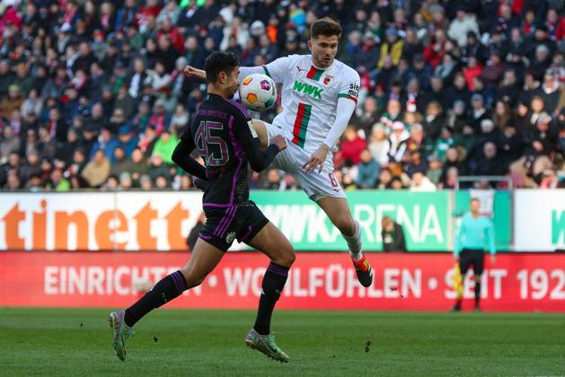 in duel, action, with Alexandar Pavlovic 45 FC Bayern Muenchen , Elvis Rexhbecaj 8 FC Augsburg , FC Augsburg vs FC Bayern Muenchen, Soccer, 1 Bundesliga, 19 Matchday, 27 01 2024 DFB regulations prohibit any use of photographs as image sequences and or quasi video Augsburg Bayern Germany Copyright: xkolbert-press ChristianxKolbertx