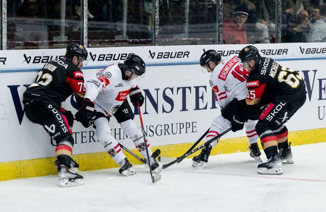 Fight for the puck duel between Dominik Kahun Team Germany, 72 and Marc Michaelis Team Germany, 65 with Kilian Zuendel Team Austria, 14 and Benjamin Baumgartner Team Austria, 18 GER, Germany vs. Austria, ice hockey, test match, World Championship preparation 2024, 25 04 2024 GER, Germany vs. Austria, ice hockey, test match, World Championship preparation 2024, 25 04 2024 Garmisch Partenkirchen Copyright: xEibner-Pressefoto FranzxFeinerx EP_HFR