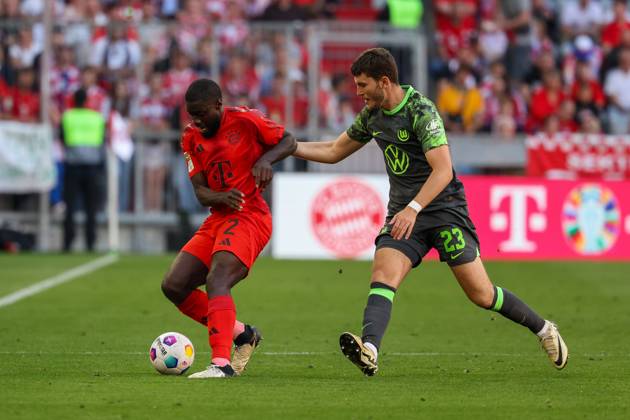 in duel, action, with Dayot Upamecano 2 FC Bayern Muenchen , Jonas Wind 23 VfL Wolfsburg , FC Bayern Muenchen vs VfL Wolfsburg, Football, 1 Bundesliga, 33 Matchday, 12 05 2024 DFB regulations prohibit any use of photographs as image sequences and or quasi video Muenchen Bayern Germany Copyright: xkolbert-press ChristianxKolbertx