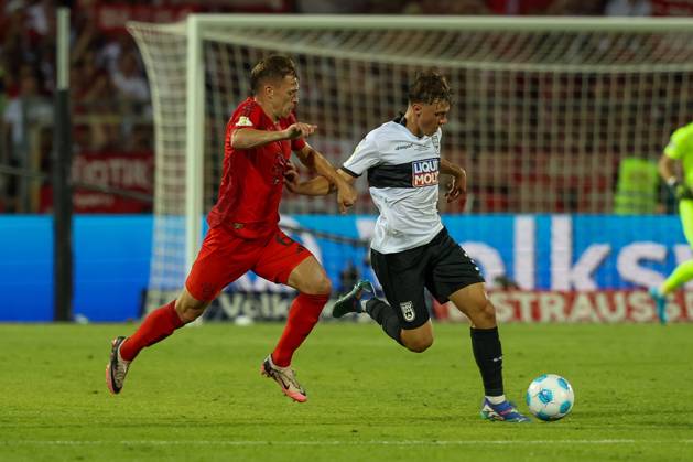 in duel, action, with Joshua Kimmich 6 FC Bayern Muenchen , Maurice Krattenmacher 30 SSV Ulm 1846 , SSV Ulm 1846 vs FC Bayern Muenchen, Football, DFB Pokal, 1 Runde, 16 08 2024 DFB regulations prohibit any use of photographs as image sequences and or quasi video Ulm Baden Wuerttemberg Germany Copyright: xkolbert-press ChristianxKolbertx