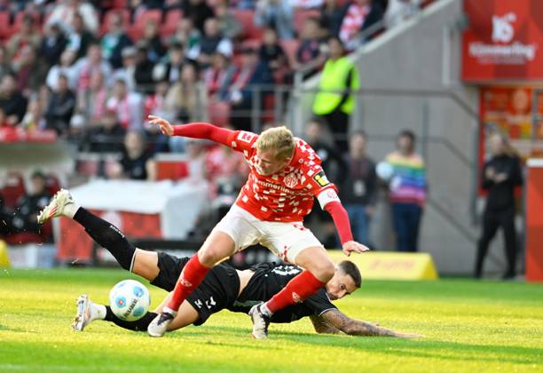 Soccer Bundesliga Season 2024 2025 Mewa Arena Mainz 15 09 2024 1 FSV Mainz 05 mz SV Werder Bremen wb 1 2 Jonathan BURKARDT 1 FSV Mainz 05 , fouled in front by Marco FRIEDL SV Werder Bremen DFL REGULATIONS PROHIBIT ANY USE OF PHOTOGRAPHS AS IMAGE SEQUENCES AND OR QUASI VIDEO EDITORIAL USE ONLY NATIONAL AND INTERNATIONAL NEWS AGENCIES OUT Soccer Bundesliga 1 FSV Mainz 05
