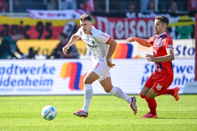 Maximilian Eggestein SC Freiburg and Marvin Pieringer 1 FC Heidenheim in a duel during the Bundesliga match between 1 FC Heidenheim 1846 and SC Freiburg, Voith Arena on September 21, 2024 in Heidenheim, Germany Photo by Harry Langer DeFodi Images Maximilian Eggestein SC Freiburg and Marvin Pieringer 1 FC Heidenheim battle for the ball during the Bundesliga match between 1 FC Heidenheim 1846 and SC Freiburg at Voith Arena on September 21, 2024 in Heidenheim, Germany Photo by Harry Langer DeFodi Images DFL regulations prohibit any use of photographs as image sequences and or quasi video Defodi 541 FCHSCF20240920 148 Defodi-541 DFL regulations prohibit any use of photographs as image sequences and or quasi-video.