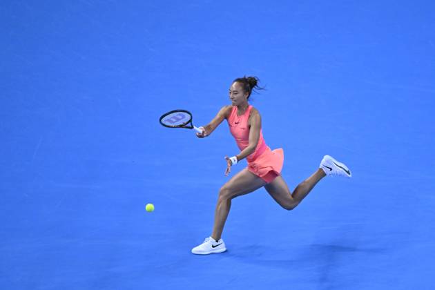 (241003) -- BEIJING, Oct. 3, 2024 -- Zheng Qinwen hits a return during the women s singles round of 16 match between Amanda Anisimova of the United States and Zheng Qinwen of China at the 2024 China Open tennis tournament in Beijing, China, Oct. 2, 2024. ) (SP)CHINA-BEIJING-TENNIS-CHINA OPEN-WOMEN S SINGLES(CN) ZhangxLong