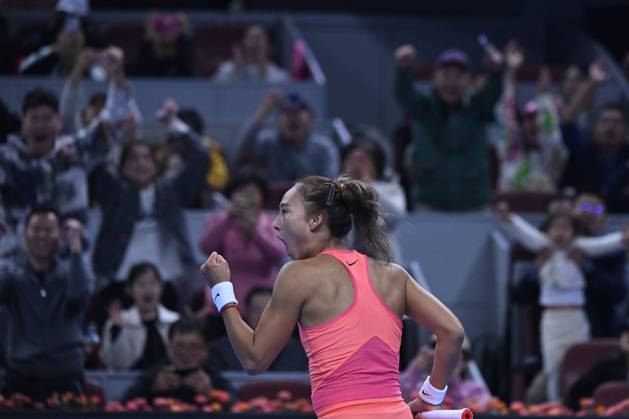 (241004) -- BEIJING, Oct. 4, 2024 -- Zheng Qinwen celebrates victory after the women s singles quarterfinal match between Zheng Qinwen of China and Mirra Andreeva of Russia at the 2024 China Open tennis tournament in Beijing, China, Oct. 4, 2024. ) (SP)CHINA-BEIJING-TENNIS-CHINA OPEN-WOMEN S SINGLES(CN) ZhangxLong
