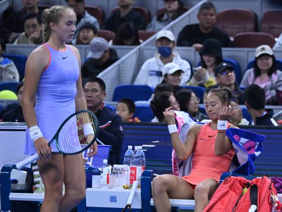 (241004) -- BEIJING, Oct. 4, 2024 -- Zheng Qinwen (R) and Mirra Andreeva react during the women s singles quarterfinal match between Zheng Qinwen of China and Mirra Andreeva of Russia at the 2024 China Open tennis tournament in Beijing, China, Oct. 4, 2024. ) (SP)CHINA-BEIJING-TENNIS-CHINA OPEN-WOMEN S SINGLES(CN) ZhangxLong