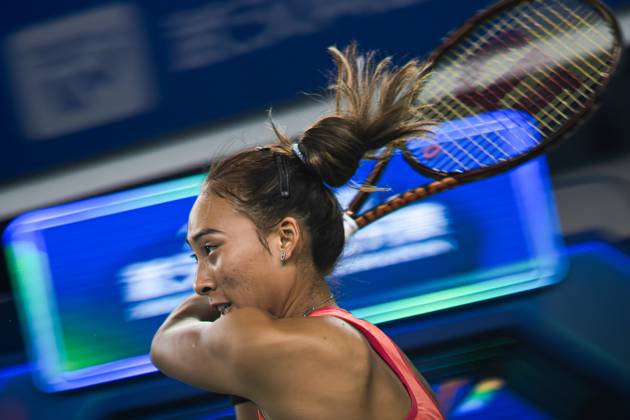 (241010) -- BEIJING, Oct. 10, 2024 -- Zheng Qinwen hits a return during the round of 32 match between Zheng Qinwen of China and Jaqueline Cristian of Romania at the 2024 Wuhan Open tennis tournament in Wuhan, capital of central China s Hubei Province, Oct. 9, 2024. ) XINHUA PHOTOS OF THE DAY XiaoxYijiu