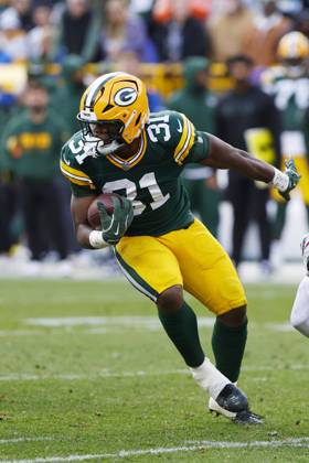 GREEN BAY, WI - OCTOBER 13: Green Bay Packers running back Emanuel Wilson (31) spins out of a tackle during a game between the Green Bay Packers and the Arizona Cardinals at Lambeau Field on October 13, 2024 in Green Bay, WI. (Photo by Larry Radloff Icon Sportswire) NFL, American Football Herren, USA OCT 13 Cardinals at Packers EDITORIAL USE ONLY Icon02410135877