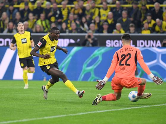 Serhou Guirassy Borussia Dortmund and goalkeeper Nikola Vasilj FC St Pauli battle for the ball during the Bundesliga match between Borussia Dortmund and FC St Pauli 1910, SIGNAL IDUNA PARK on October 18, 2024 in Dortmund, Germany, Germany Photo by Ralf Treese DeFodi Images Serhou Guirassy Borussia Dortmund and goalkeeper Nikola Vasilj FC St Pauli battle for the ball during the Bundesliga match between Borussia Dortmund and FC St Pauli 1910 at Signal Iduna Park on October 18, 2024 in Dortmund, Germany Photo by Ralf Treese DeFodi Images DFL regulations prohibit any use of photographs as image sequences and or quasi video not used in POL SRB CRO FRA GBR NED ITA USA Defodi 521 BVBSTP20241018 011 Defodi-521 not used in POL SRB CRO FRA GBR NED ITA USA DFL regulations prohibit any use of photographs as image sequences and or quasi-video.