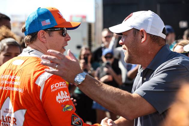 LAS VEGAS, NV - OCTOBER 20: Brad Keselowski ( 6 RFK Racing King s Hawaiian Ford) greets UNLV football coach Barry Odom (R) prior to the start of the South Point 400 NASCAR, Motorsport, USA Cup Series playoff race on October 20, 2024, at Las Vegas Motor Speedway in Las Vegas, NV. (Photo by Christopher Trim Icon Sportswire) AUTO: OCT 20 NASCAR Cup Series South Point 400 EDITORIAL USE ONLY Icon241020516