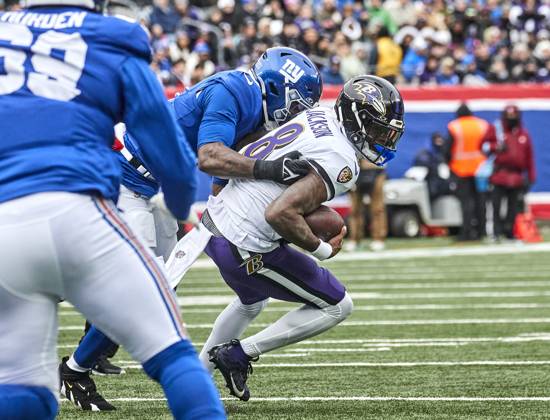 Baltimore Ravens quarterback Lamar Jackson (8) is sacked by New York Giants linebacker Brian Burns (0) during a NFL, American Football Herren, USA game at MetLife Stadium in East Rutherford, New Jersey. CSM East Rutherford United States - ZUMAc04_ 20241215_zma_c04_129 Copyright: xDuncanxWilliamsx