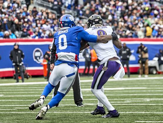 Baltimore Ravens quarterback Lamar Jackson (8) is sacked by New York Giants linebacker Brian Burns (0) during a NFL, American Football Herren, USA game at MetLife Stadium in East Rutherford, New Jersey. CSM East Rutherford United States - ZUMAc04_ 20241215_zma_c04_146 Copyright: xDuncanxWilliamsx
