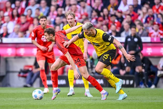 Josip Stanisic FC Bayern Muenchen and Niklas Suele BV Borussia Dortmund in a duel during the Bundesliga match between FC Bayern München and Borussia Dortmund, Allianz Arena on April 12, 2025 in Munich, Germany Photo by Harry Langer DeFodi Images Josip Stanisic FC Bayern Muenchen and Niklas Suele BV Borussia Dortmund battle for the ball during the Bundesliga match between FC Bayern München and Borussia Dortmund at Allianz Arena on April 12, 2025 in Munich, Germany Photo by Harry Langer DeFodi Images DFL regulations prohibit any use of photographs as image sequences and or quasi video Photo by Harry Langer DeFodi Images DFL regulations prohibit any use of photographs as image sequences and or quasi video