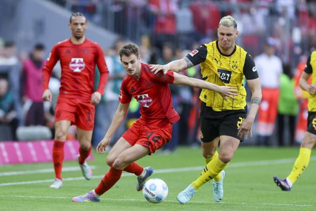 Josip Stanisic FC Bayern Muenchen and Niklas Suele Borussia Dortmund battle for the ball, Bundesliga, FC Bayern München v Borussia Dortmund, Allianz Arena, April 12, 2025 in Munich, Germany Photo by Marco Steinbrenner DeFodi Images Josip Stanisic FC Bayern Muenchen and Niklas Suele Borussia Dortmund battle for the ball, Bundesliga, FC Bayern München v Borussia Dortmund, Allianz Arena, April 12, 2025 in Munich, Germany Photo by Marco Steinbrenner DeFodi Images DFL regulations prohibit any use of photographs as image sequences and or quasi video
