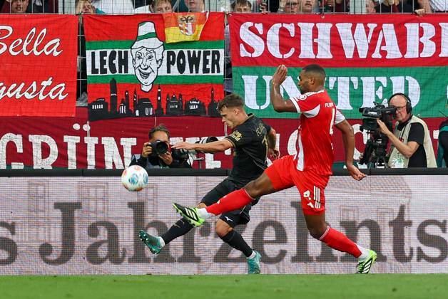 in duel, action, with Robin Fellhauer 19 FC Augsburg , Jonathan Tah 4 FC Bayern Muenchen , FC Augsburg vs FC Bayern Muenchen, Soccer, 1 Bundesliga, 2 Matchday, 30 08 2025 DFB regulations prohibit any use of photographs as image sequences and or quasi video Augsburg Bayern Germany Copyright: xkolbert-press ChristianxKolbertx