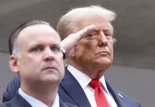 President Donald Trump salutes during the playing of the National Anthem before Jannik Sinner of Italy plays Carlos Alcaraz of Spain in the Men s Finals of the 2025 US Open Tennis Championship in Arthur Ashe Stadium at the USTA Billie Jean King National Tennis Center in Flushing Meadows, New York, on Sunday, September 7, 2025. NYP20250907117 COREYxSIPKIN