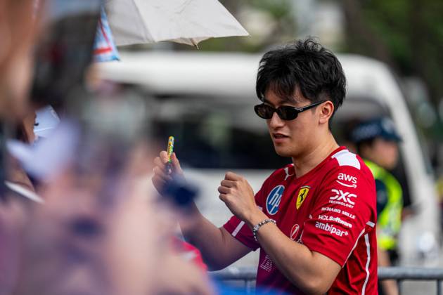Formula 1 Singapore Airlines Singapore Grand Prix - Arrivals Guanyu Zhou (CHN) – Reserve Driver, Scuderia Ferrari with the fans on Thursday (Media Day) during Formula 1 Singapore Airlines Singapore Grand Prix 2025 at the Marina Bay Street Circuit Singapore on October 2, 2025. Photo by Antoine Lapeyre ABACAPRESS.COM Singapore Singapore  Copyright: xLapeyrexAntoine ABACAx