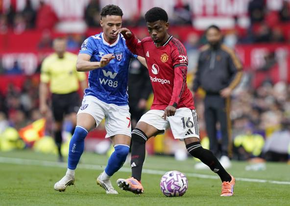 Manchester, England, 4th October 2025. Amad Diallo of Manchester United, ManU (R) is challenged by Chemsdine Talbi of Sunderland during the Manchester United vs Sunderland Premier League match at Old Trafford, Manchester. Picture credit should read: Andrew Yates Sportimage EDITORIAL USE ONLY. No use with unauthorised audio, video, data, fixture lists, club league logos or live services. Online in-match use limited to 120 images, no video emulation. No use in betting, games or single club league player publications. SPI_070_AY_MAN_UTD_SUN SPI-4195-0062