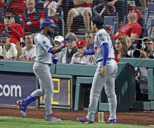 Baseball: Division Series between Dodgers and Phillies Los Angeles Dodgers right fielder Teoscar Hernandez (L) is greeted by Shohei Ohtani after hitting a three-run home run in the seventh inning of Game 1 of the National League Division Series against the Philadelphia Phillies at Citizens Bank Park in Philadelphia on Oct. 4, 2025. A14AA0004911888P